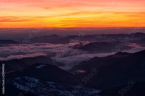 Amazing sunrise in Ceahlau mountains, winter landscape.