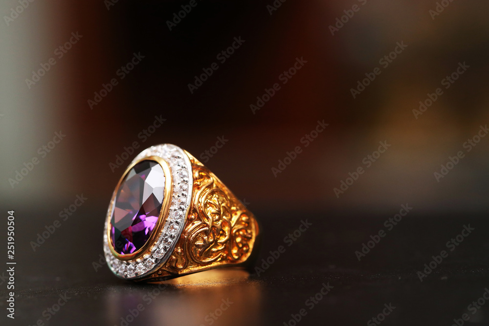Purple gem stone on gold ring with diamond Purple gem stone on gold ring with diamond