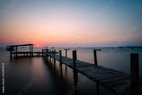 Old wooden bridge Lonely in the sea. © Natnan