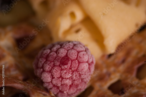 crepes on a plate with raspberries
