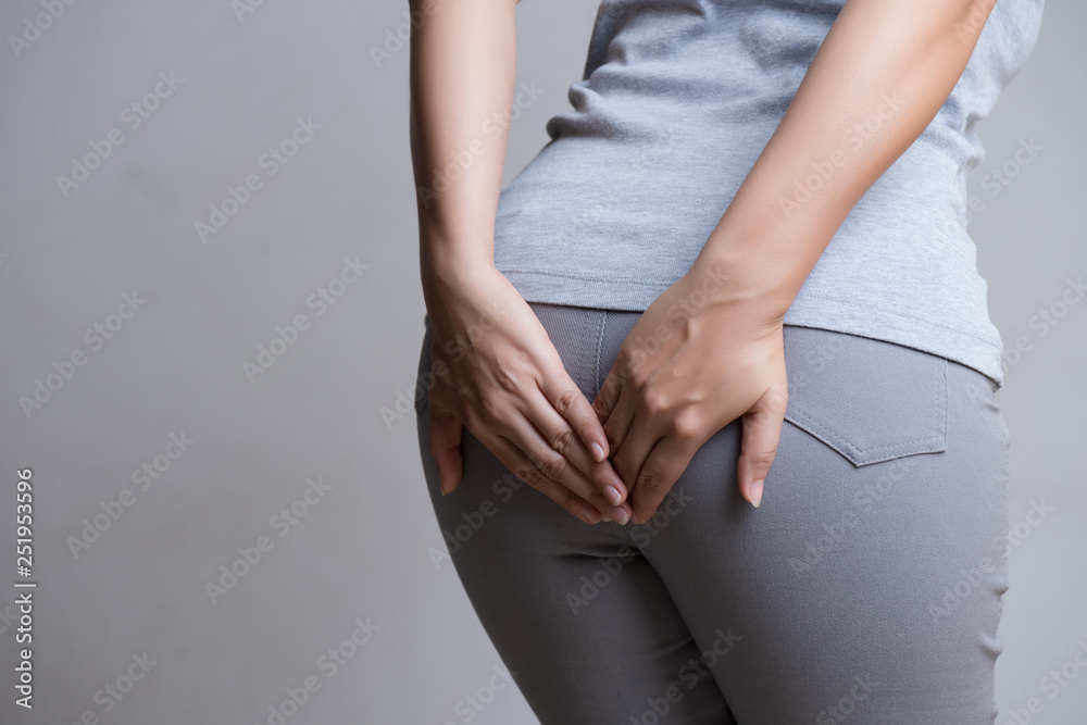 Woman suffering from hemorrhoids and hand holding her bottom because having  Abdominal pain. Health care concept. foto de Stock | Adobe Stock