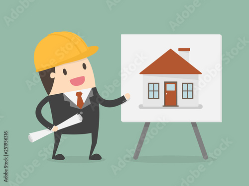 Young Engineer Presenting House Building On Whiteboard.