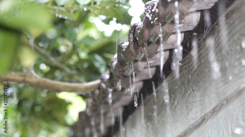 Rain falling strongly with focus on a roof siding