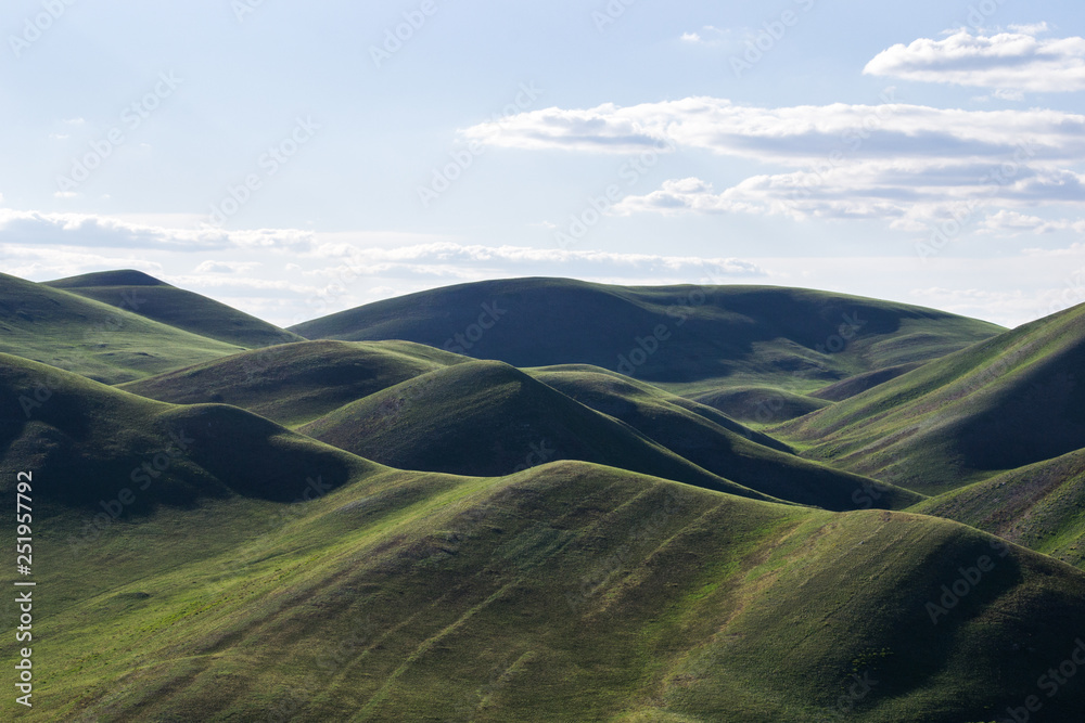 green, textured hills - the beginning of the Ural mountains