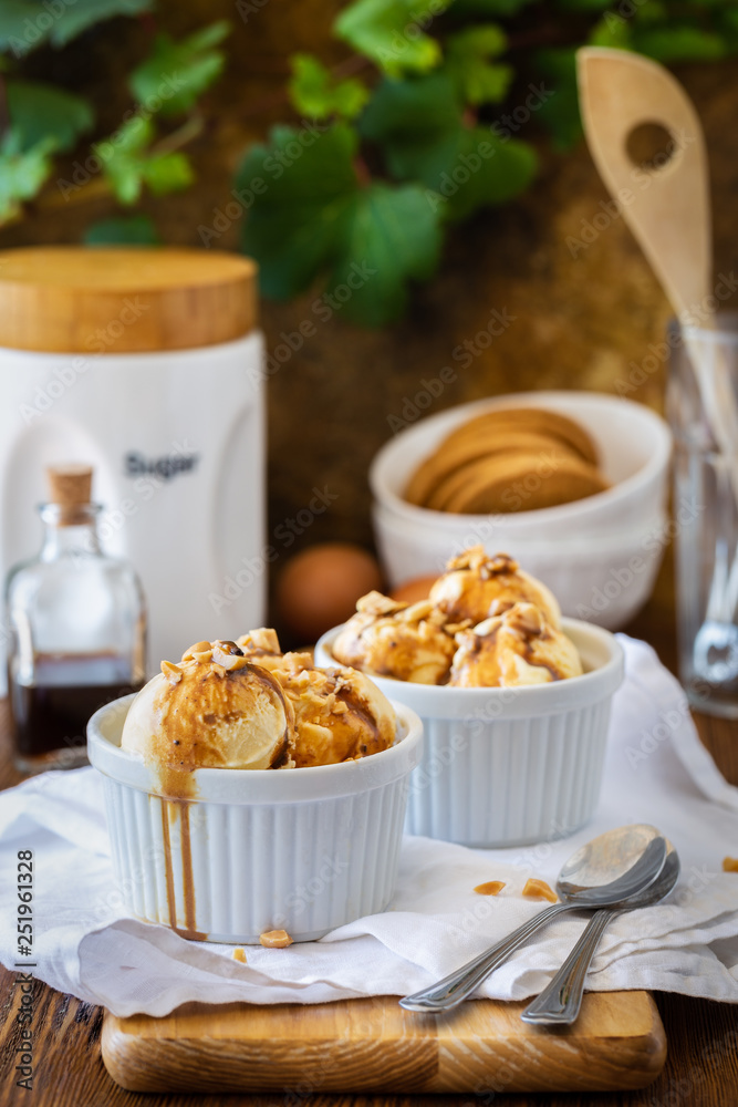 Delicious ice cream with caramel syrup in a bowl