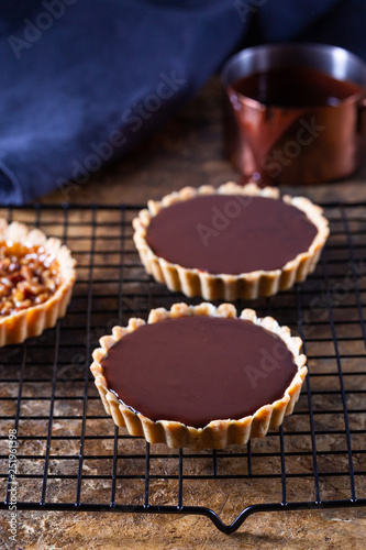 Chocolate tarts on a cooling rack