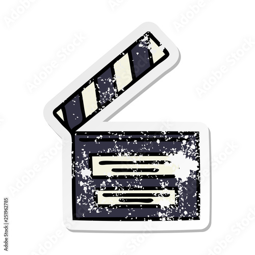 distressed sticker of a cute cartoon film clapper board