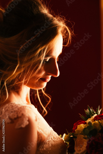Portrait young beauty bride near the window