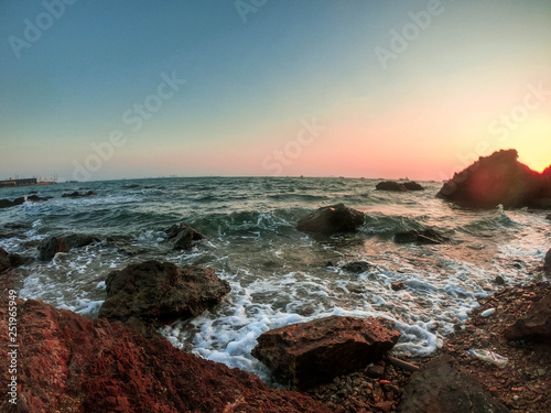 sunset on coast of sea