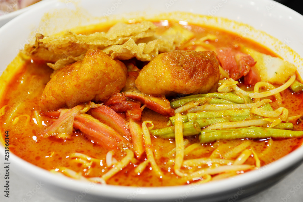 Curry Mee noodles with spicy curry soup with dried tofu, Malaysia cuisine