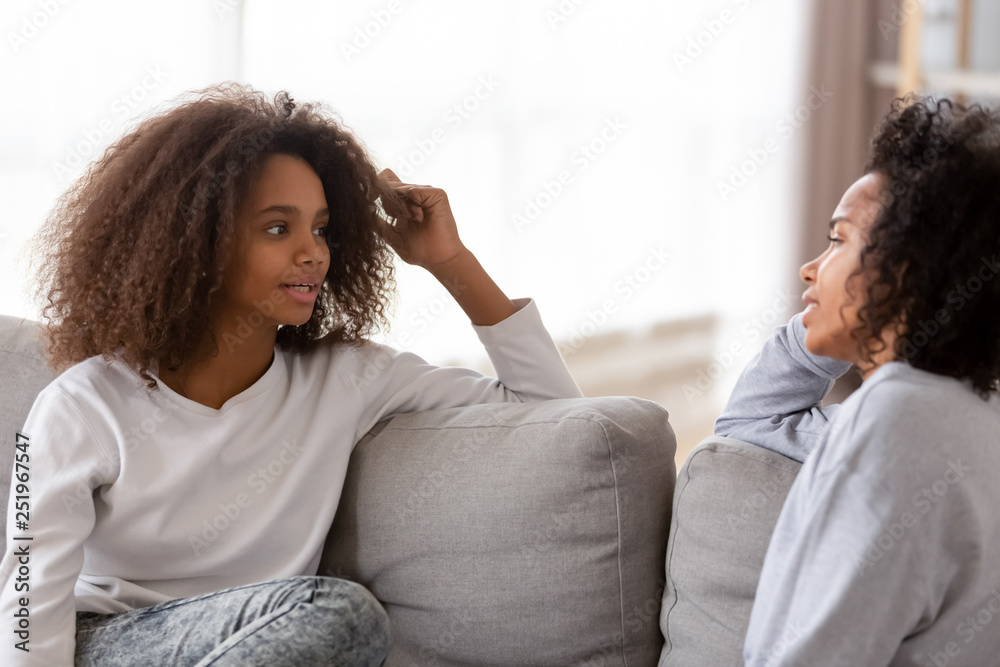 African mother and daughter chatting spending free time at home African mother and daughter chatting spending free time at home
