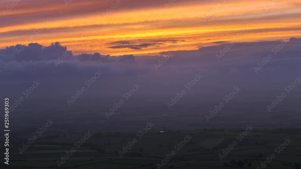 Hazy Autumnal Sunset over Scenic Hills in UK Hazy Autumnal Sunset over Scenic Hills in UK