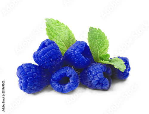 Fresh ripe raspberries with mint leaves on white background