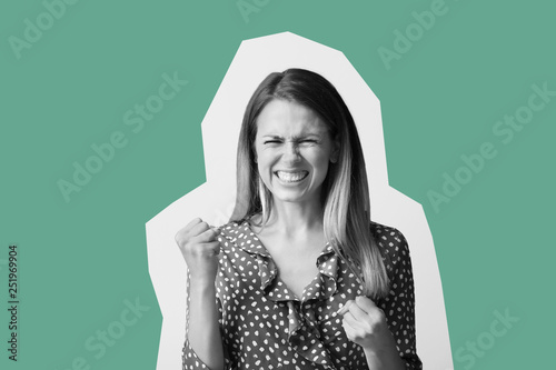 Angry young woman on color ...