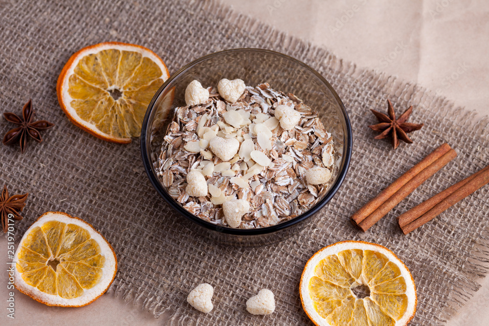 Healthy food. Muesli in a bowl on a light background. Porridge for breakfast on a linen background Healthy food. Muesli in a bowl on a light background. Porridge for breakfast on a linen background