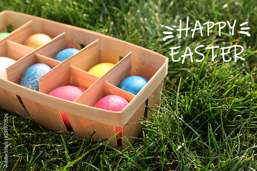 Box with Easter eggs on gre...