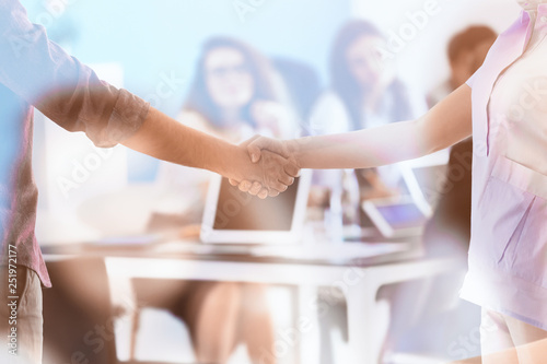 People shaking hands during...