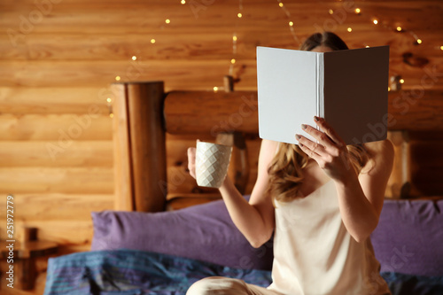 Beautiful woman reading boo...