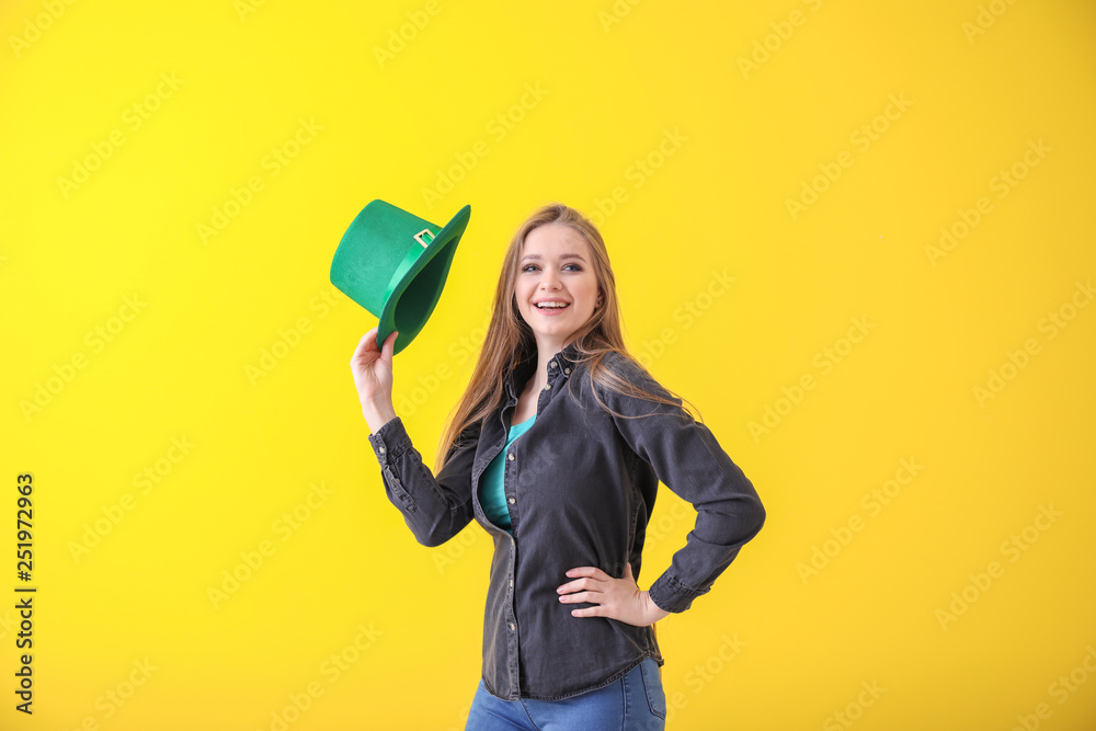 Beautiful young woman with green hat on color background. St. Patrick's Day celebration Beautiful young woman with green hat on color background. St. Patrick's Day celebration
