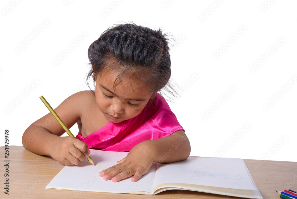 Cute cheerful child drawing using color pencil while sitting at table isolated on white background Cute cheerful child drawing using color pencil while sitting at table isolated on white background