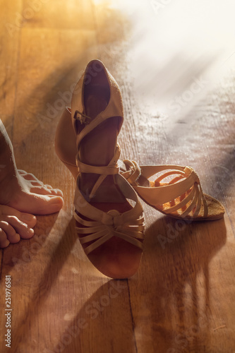 Female legs and shoes for ballroom dancing close-ups. Preparations for performance, for the dance concept