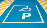 the signs of places for people with disabilities in the parking lot for cars. Handicapped symbol on parking space, Disability symbol painted on the floor