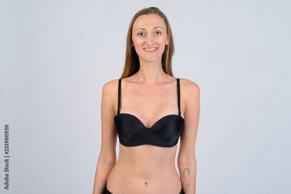 Portrait of happy blonde woman wearing bikini and smiling Portrait of happy blonde woman wearing bikini and smiling