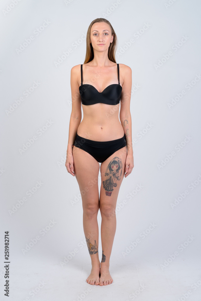 Full body shot of blonde woman wearing bikini Full body shot of blonde woman wearing bikini