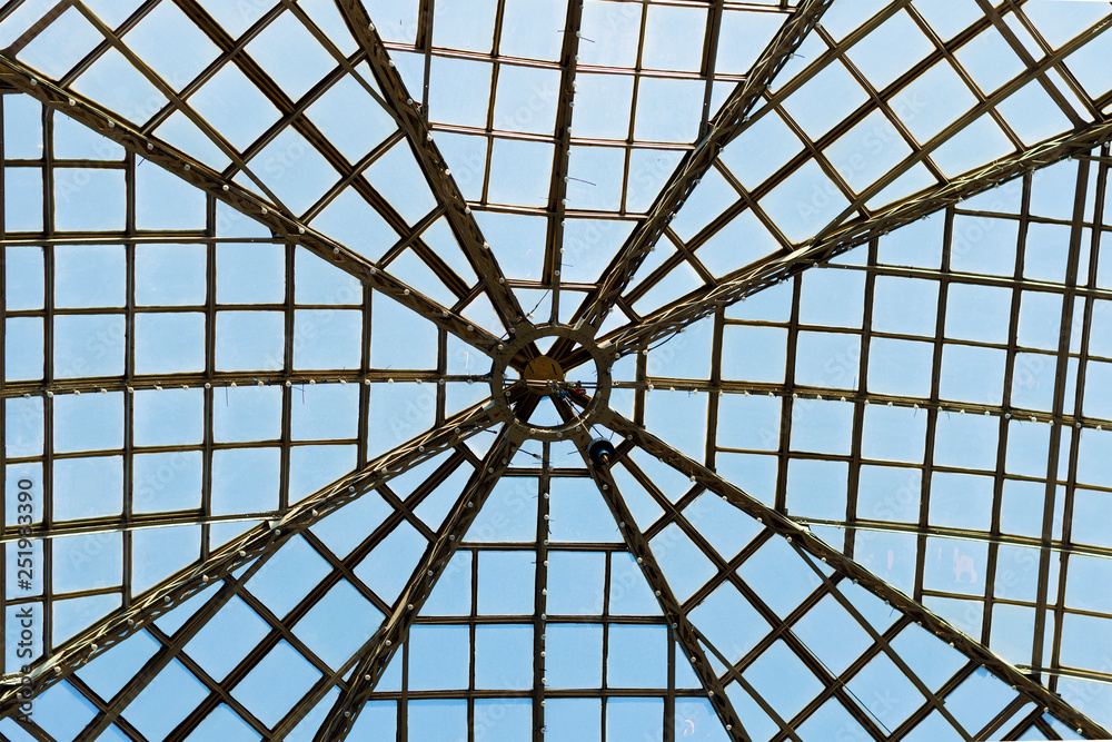 symmetrical line of glass roof silhouette rays, background is blue sky. image for background, wallpaper, backdrop