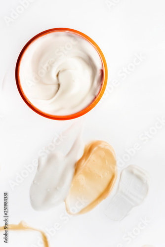 Smeared creme on white background. Dermatology and skincare. Beauty conception.