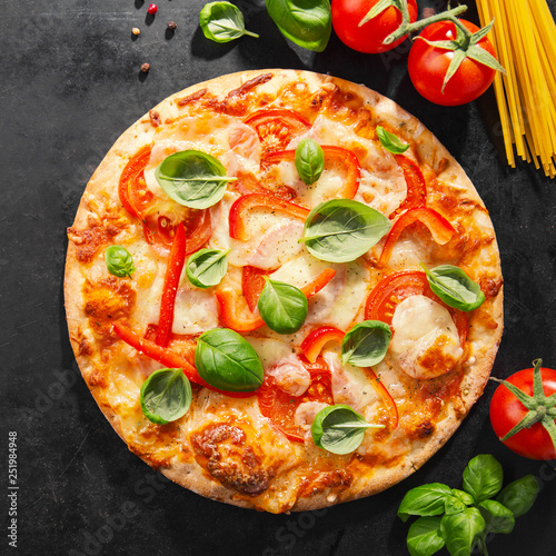 Tasty vegetarian pizza on dark background