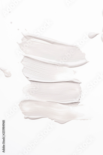 Fototapeta Naklejka Na Ścianę i Meble -  Smeared creme on white background. Dermatology and skincare. Beauty conception.