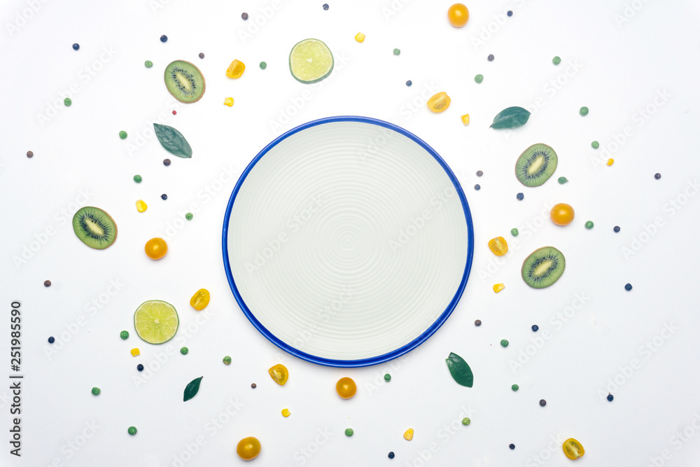 Food flat lay: spring summer concept with empty plate. Vegan vegetables and fruit detox background. Minimal flat lay concept. Kids fun food idea. Copy space. Food flat lay: spring summer concept with empty plate. Vegan vegetables and fruit detox background. Minimal flat lay concept. Kids fun food idea. Copy space.