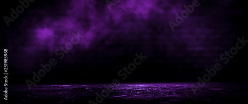 Dark empty room  old brick walls  concrete floor  smoke  pyal  smog. Violet abstract light  night view.