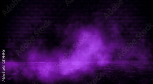 Dark empty room, old brick walls, concrete floor, smoke, pyal, smog. Violet abstract light, night view.