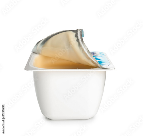 Container with tasty yogurt on white background photo