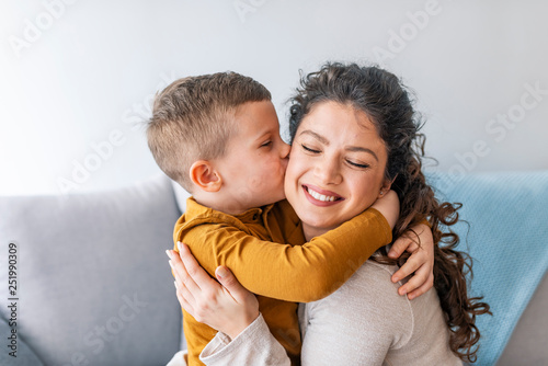 Son is kissing his mother