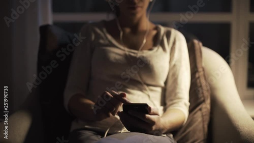 Wallpaper Mural Girl relaxing at home at night and listening to music Torontodigital.ca