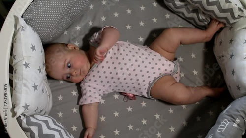 Newborn baby. Little baby. Child. Adorable baby girl. Baby in crib. Baby in bed