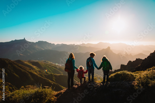 Mother with kids travel in mountains, family hiking © nadezhda1906