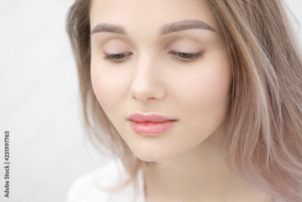 Close-up of the face of a beautiful young blonde girl with smooth skin. Close-up of the face of a beautiful young blonde girl with smooth skin.