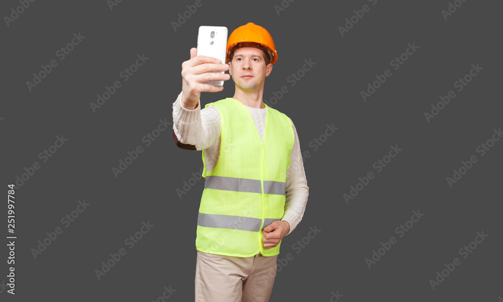 the man in a helmet takes a selfie