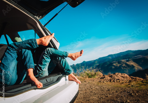 kids relax while travel by car in nature, family vacation in mountains