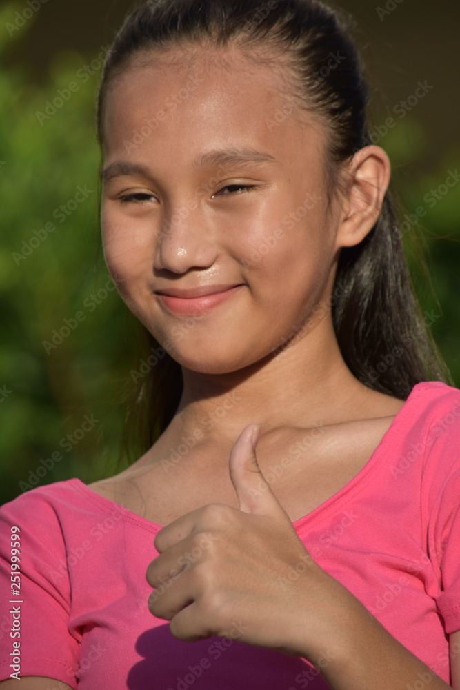 Pretty Asian Female With Thumbs Up