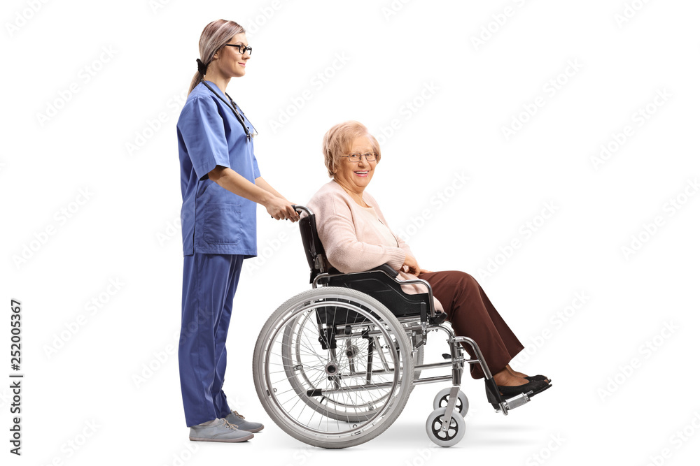 Nurse pushing a senior woman in a wheelchair Nurse pushing a senior woman in a wheelchair