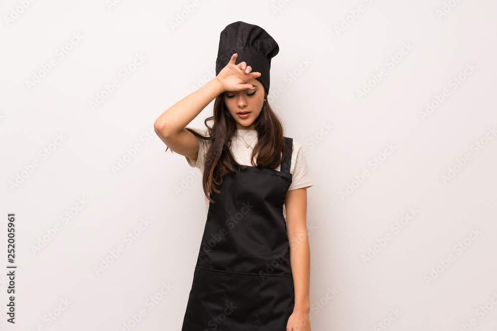 Teenager chef over white wall with tired and sick expression Teenager chef over white wall with tired and sick expression