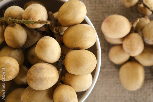 Malaysia's local fruit, langsat or Lansium parasiticum shot on isolated background.