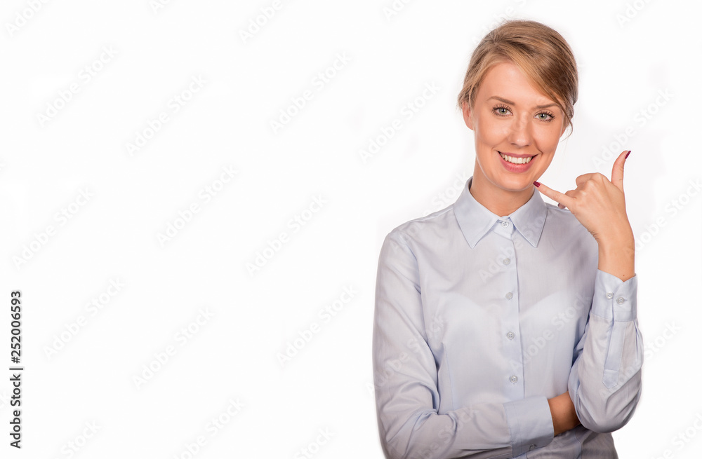 Pretty woman gesturing a phone call while looking at you Pretty woman gesturing a phone call while looking at you