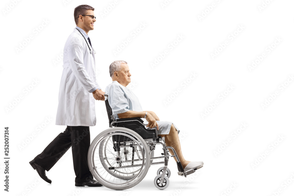Young male doctor pushing a male patient in a wheelchair Young male doctor pushing a male patient in a wheelchair