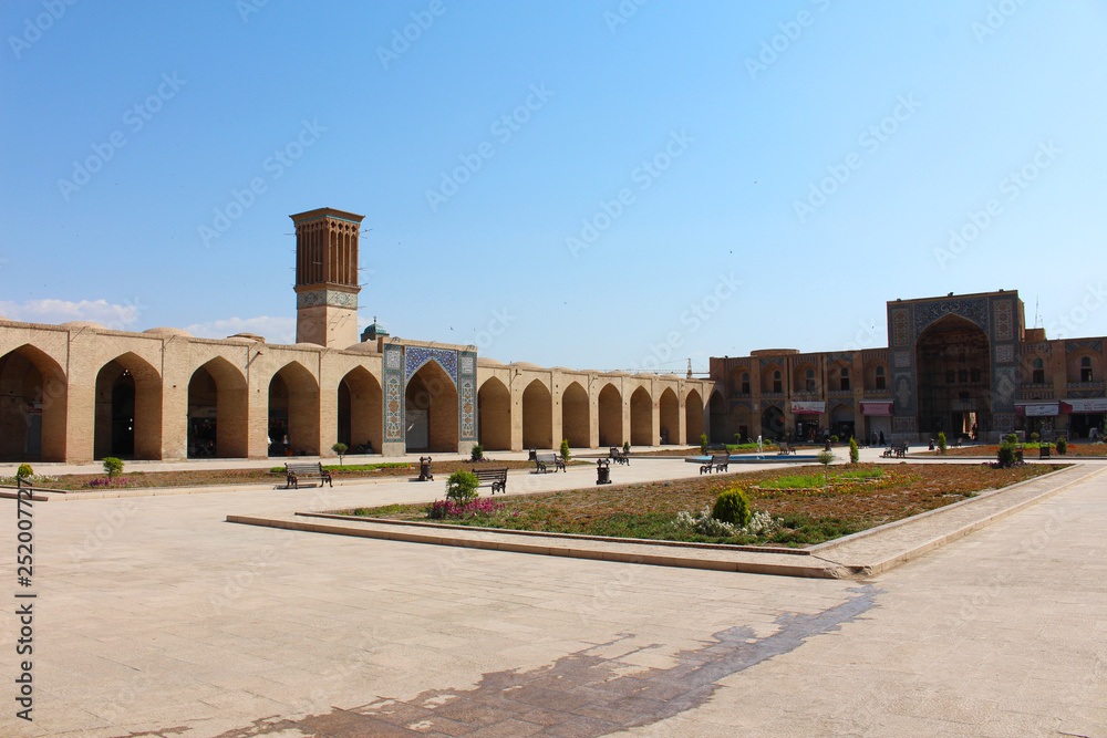 The Ganjali Khan Complex is a Safavid-era building complex, located in the old center of city of Kerman, Iran. The complex is composed of a school, a square, a caravanserai, a bathhouse, an Ab Anbar (